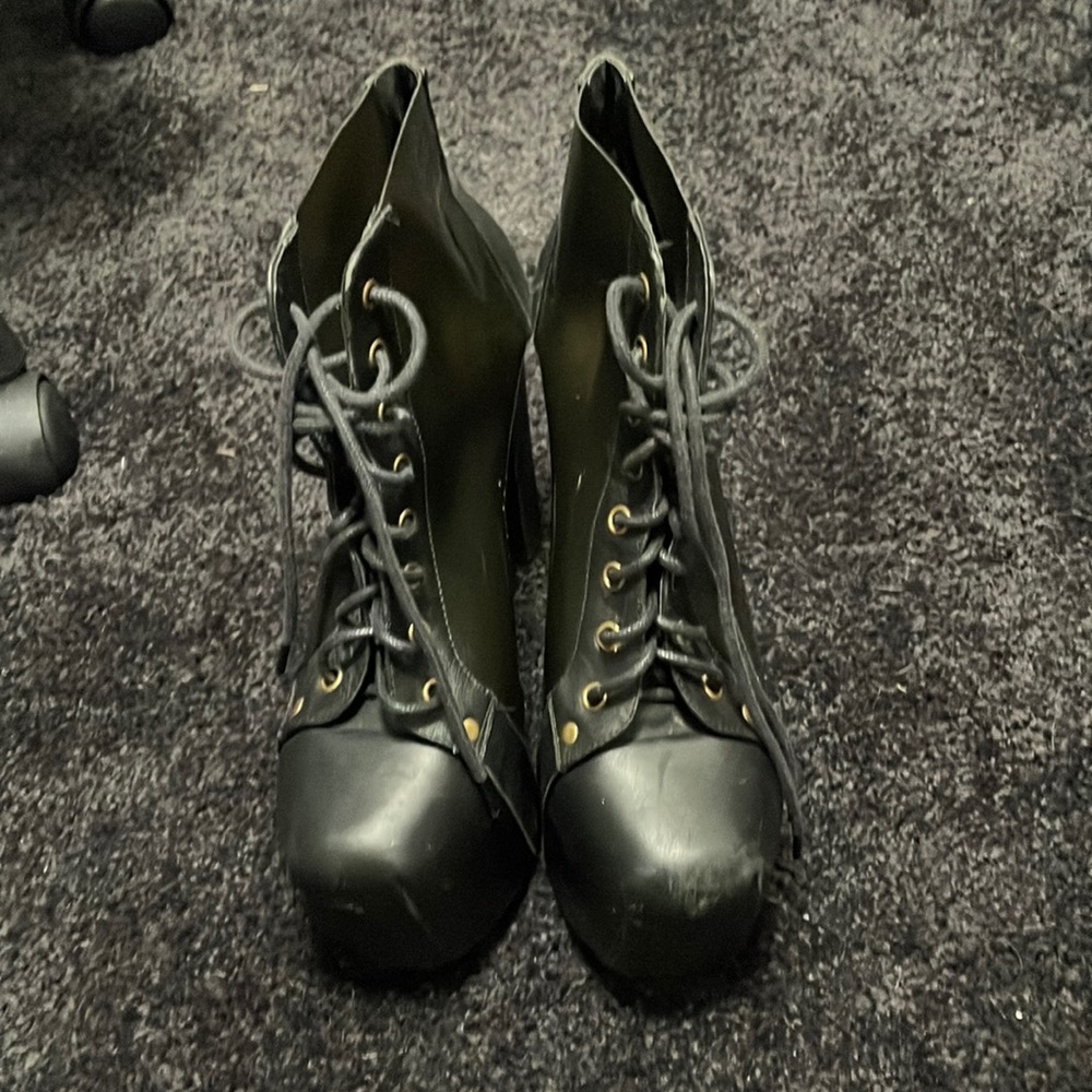 Cleata smoke color with black heel, worn, signs of normal wear and tear.